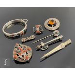 Eight items of Scottish silver and white metal jewellery, six pebble set examples to include a