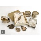 A small parcel lot of assorted hallmarked silver items, a trowel bookmark, four napkin rings, a