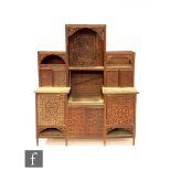 A late 19th Century Anglo Indian carved hardwood side cabinet, the pierced fret carved panel back