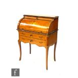 A reproduction marquetry inlaid walnut tambour top bonheur du jour or bureau in the French taste,