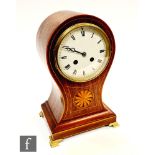 An Edwardian inlaid balloon shaped mantle clock, circular white enamelled dial with eight day