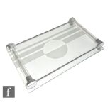An Art Deco tray with a rectangular clear glass base etched with a linear and circle motif, fitted