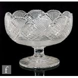 A 19th Century Anglo-Irish pedestal bowl of circular section with scalloped rim and fine cut body