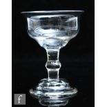 An 18th Century sweetmeat glass circa 1750, the double ogee bowl with everted rim, over a plain stem