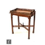 A late 20th Century reproduction hardwood silver table in the Chippendale style, the lift off tray