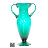 A large post war American glass vase by Blenko, of footed shouldered form with flared neck and