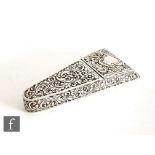 A Victorian hallmarked silver cushioned triangular scissor case decorated with foliate scrolls,