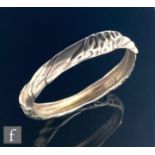 A Danish silver stiff bangle with stylised folded decoration, internal diameter 6.5cm, Ole Kortzau