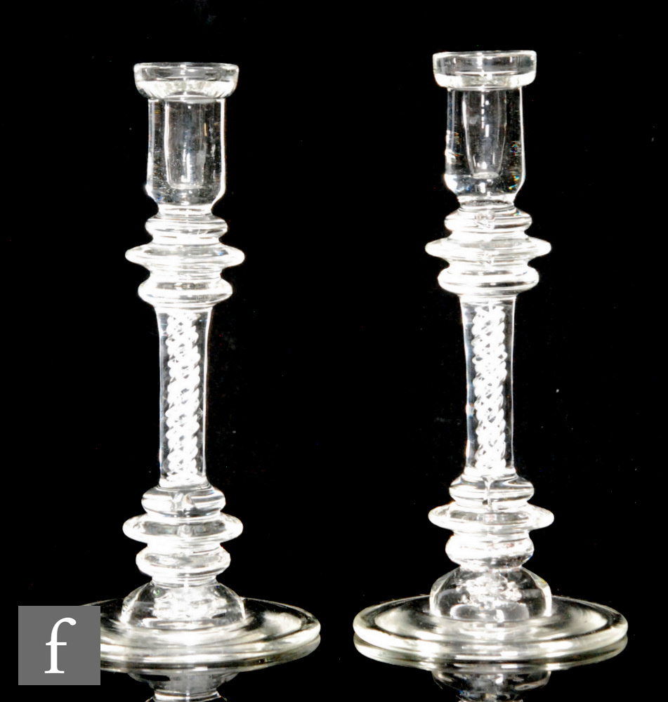 A pair of 18th Century style glass candle sticks, three ringed annulated knops above single series