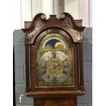 A George III mahogany longcase clock with a later associated eight-day movement striking on a