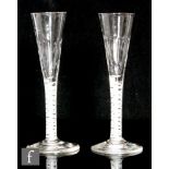 A pair of 18th Century ratafia glasses circa 1755, 1760-1765, the slender conical bowl with basal