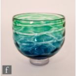 A contemporary Mermaid Range footed bowl of high sided form with a spiral band of mottled green