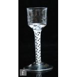 An 18th Century drinking glass circa 1760, the ogee bowl with basal moulded flutes, over a mixed