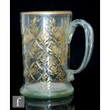 An 18th Century tankard, possibly German, of cylinder form with diamond cut pattern and gilded