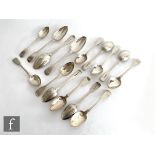 A composed set of twelve hallmarked silver fiddle pattern dessert spoons with three matched table