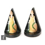 A pair of 1930s Carlton Ware bookends modelled as Britannia stood holding a shield and a long curled