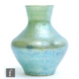 A small late 19th Century Loetz glass vase of shouldered ovoid form with flared collar neck,