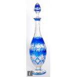 An early 20th Century Val St Lambert decanter circa 1910, of footed ovoid form, cased in blue over