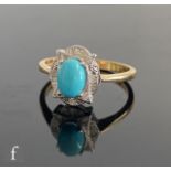 A 9ct hallmarked turquoise and diamond ring, central oval claw set turquoise within a shaped diamond