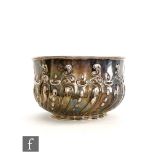 A hallmarked silver punch bowl with part embossed fluted and foliate scroll decoration below plain