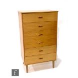 A 1970s teak chest of six drawers raised to square legs, height 122cm, width 70cm and depth 46cm,