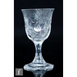 An early 20th Century Thomas Webb & Sons wine glass, the cup form bowl wrythen moulded and