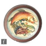 A Moorcroft Pottery framed dish decorated in the Trout pattern designed by Philip Gibson,