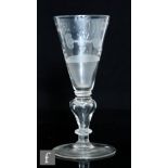 An 18th Century Friendship drinking glass circa 1710, the trumpet bowl engraved with a friendship