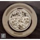 A Lalique Marienthal glass plate, pattern no. 3022, moulded to the underside with fruiting boughs,