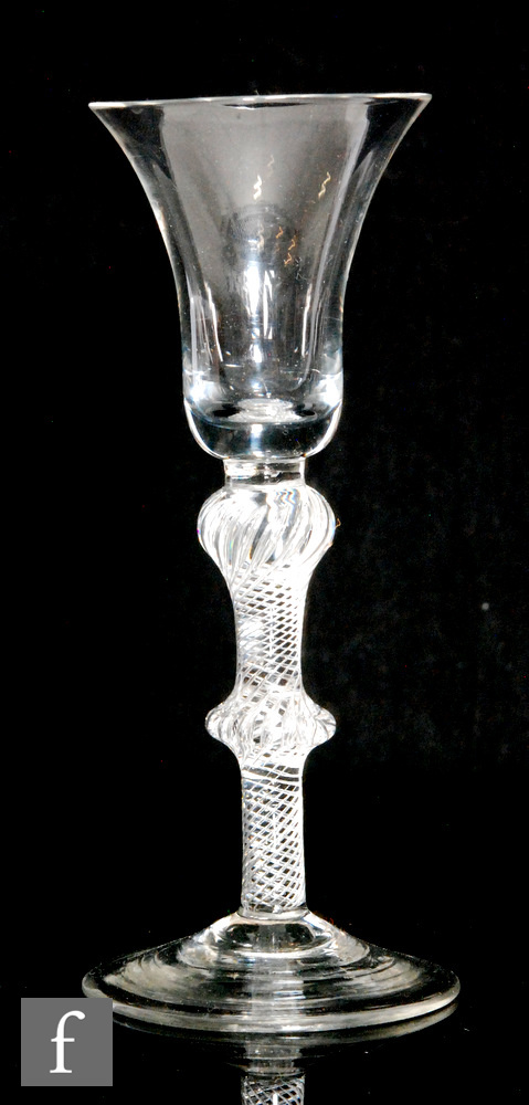 An 18th Century drinking glass circa 1760, the bell bowl above double knopped, multiple air twist