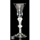 An 18th Century drinking glass circa 1760, the bell bowl above double knopped, multiple air twist