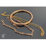 Three items of early 20th Century 9ct gold jewellery, a dog link Albert chain, a belcher link