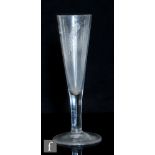 A large 18th Century barley wine glass circa 1770, the tall funnel bowl engraved with barley and a
