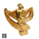 A large 1940s Art Deco chalk ware model of a dancing lady in a green dress holding a drape of