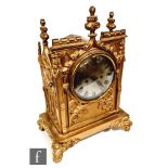 A 19th Century gilt mantle clock, the circular silvered dial inscribed O. Shaughnessey, Cork,