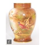 A later 20th Century Coalport vase decorated in the round by Norman Lear with hand painted pheasants