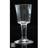 An 18th Century cider glass circa 1760, the bucket bowl above a plain stem and raised to a conical