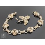 A Danish silver bracelet decorated with six stylised flower head sections, length 21cm, with a