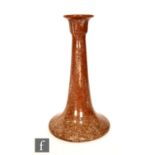 A large early 20th Century Arts and Crafts Ashby Potters Guild candlestick of tapering form