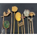 Ten assorted gold and yellow metal stick pins to include scarab beetle and seed pearl set
