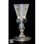 An 18th Century continental drinking glass circa 1750, the thistle shape bowl with solid base