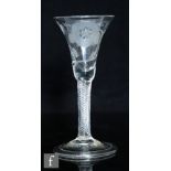 An 18th Century Jacobite drinking glass circa 1750, the drawn trumpet bowl engraved with a rose,