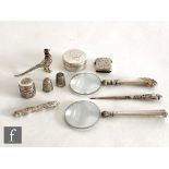 A small parcel lot of silver items to include a vesta case, two silver handled magnifying glasses, a