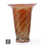 A later 20th Century Lundberg Studios studio glass vase of footed tumbler form with flared rim,