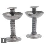 A pair of early 20th Century German Arts and Crafts Goberg candlesticks attributed in design to Hugo