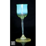 An early 20th Century Louis Comfort Tiffany Favrille liqueur glass, circa 1902, the ovoid bowl