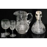 A 20th Century Tudor Crystal glass decanter of low shouldered form decorated in the Ribbin & Rose