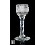 An 18th Century wine glass circa 1785, the ovoid bowl engraved with a hunting scenes with a