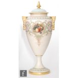 A Royal Worcester shape 2713 twin handled vase and cover decorated with a hand painted Fallen Fruits