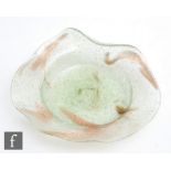 A late 19th Century Clutha Glass dish of shallow circular form with a wave and lipped rim,